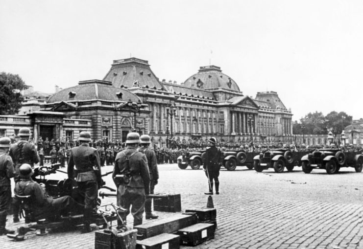 German soldiers holding a parade outside of the Royal Palace in Brussels