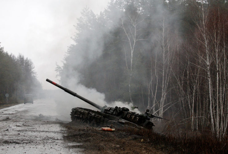 Destroyed Russian tank along the side of a road