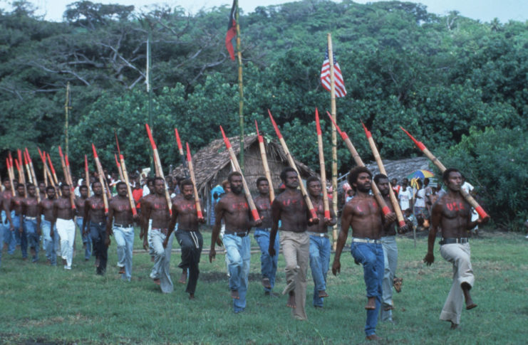 Men of the John Frum cargo cult marching together with fake guns
