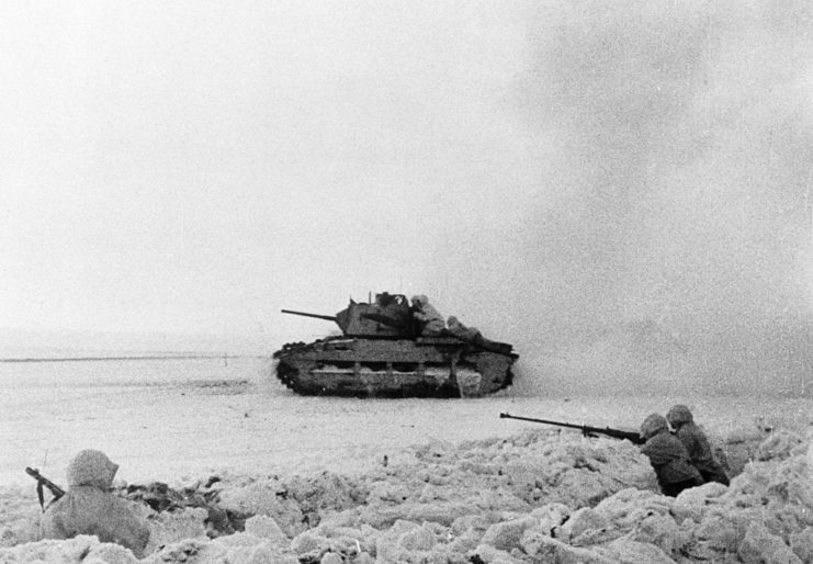 Anti-rifle tank crew watching a British tank manned by Red Army soldiers drive past