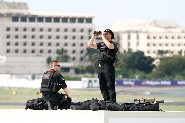 Two Secret Service snipers setting up their gear