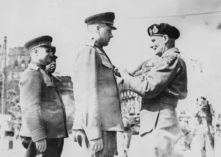 Field Marshal Bernard Montgomery pinning the Order of the Bath on Marshal Konstantin Rokossovsky's chest