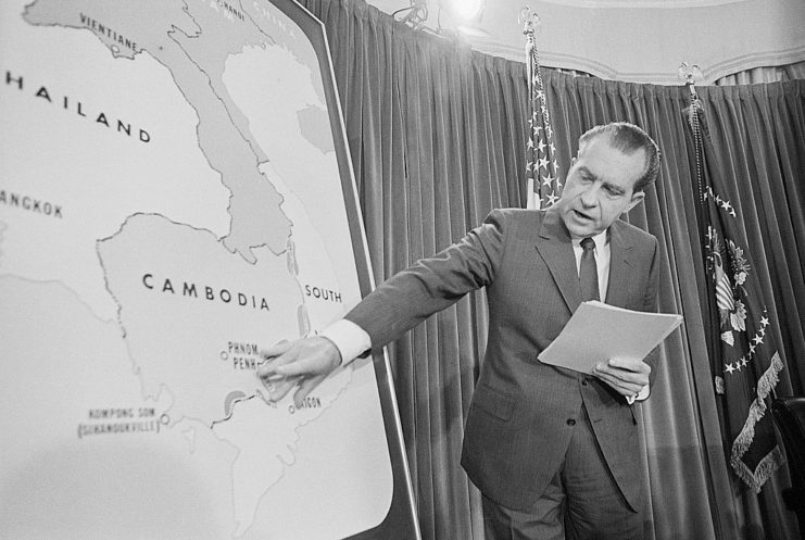 Richard Nixon pointing at a map of Cambodia