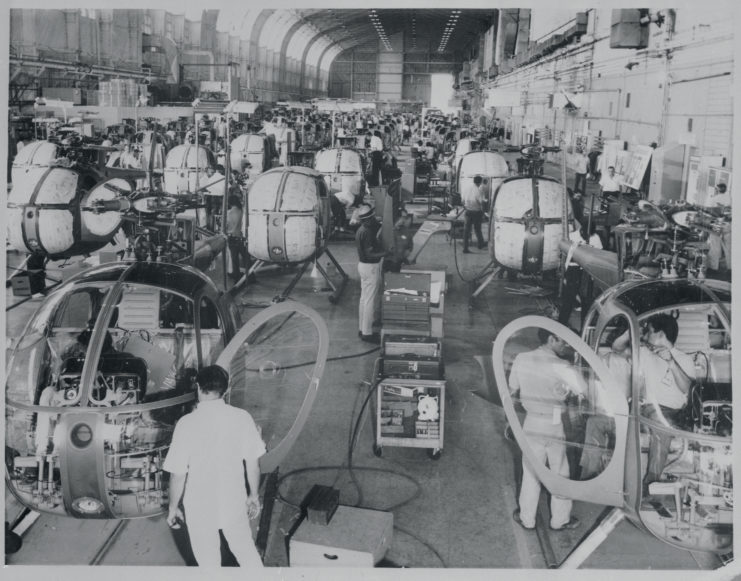 Factory workers assembling Hughes OH-6A Cayuse helicopters