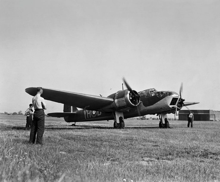 Ground crew standing around a Bristol Blenheim preparing for takeoff