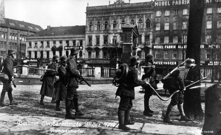 German soldiers manning flammenwerfers on a city street