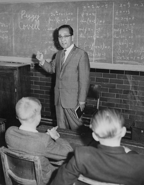 Mitsuo Fuchida speaking in front of a group of young boys