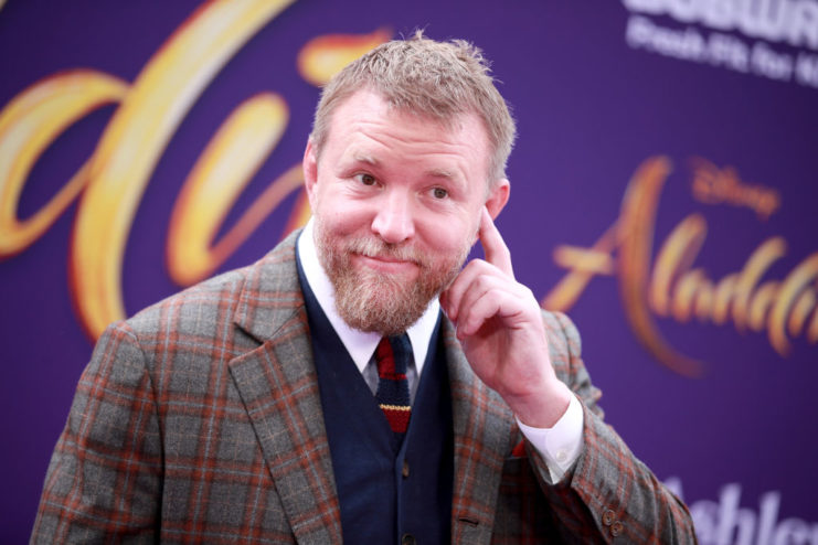 Guy Ritchie posing on a red carpet