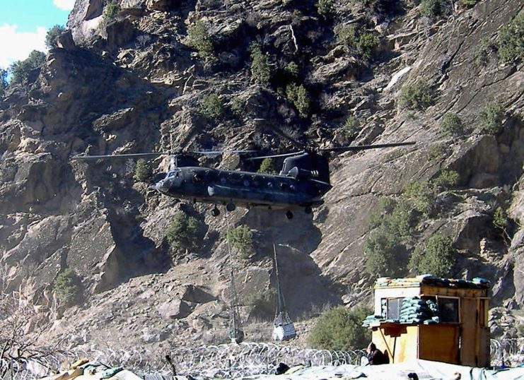 Boeing CH-47 Chinook hovering over Combat Outpost (COP) Keating