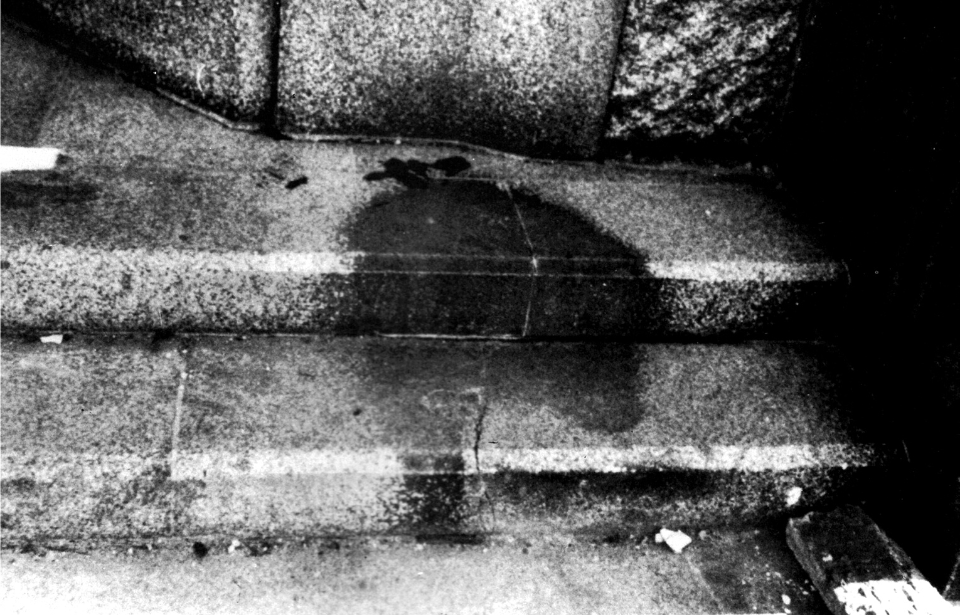 Human shadow on the steps at the entrance of the Hiroshima branch of Sumitomo Bank