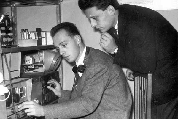 Achille and Giovanni Judica-Cordiglia standing at a desk