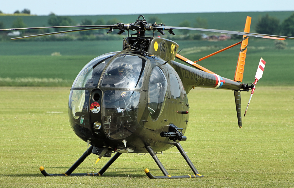 Hughes OH-6 Cayuse parked in a field