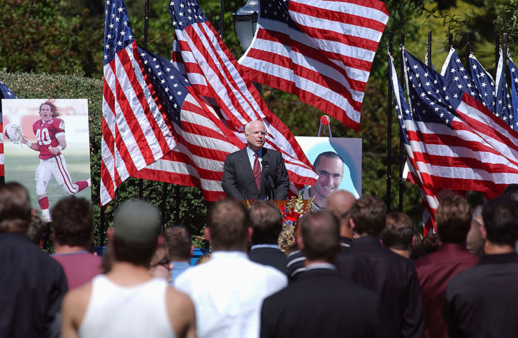 John McCain speaking in front of a large crowd