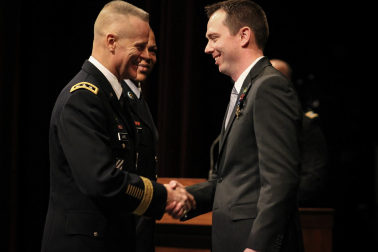 Andrew Bundermann shaking hands with Thomas James Jr.