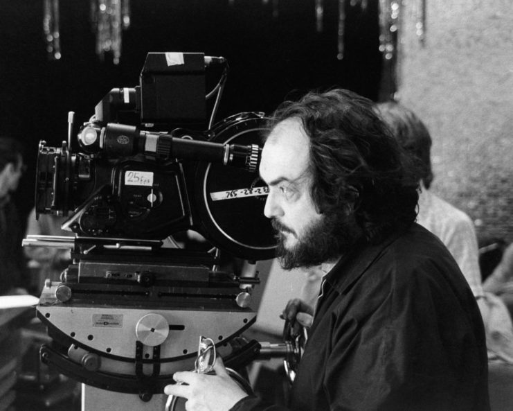 Stanley Kubrick manning a film camera