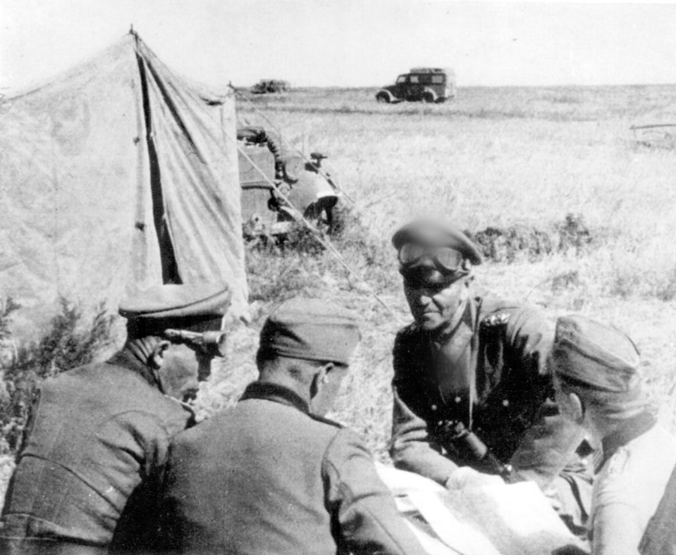 Friedrich Paulus sitting outside with three other German officers