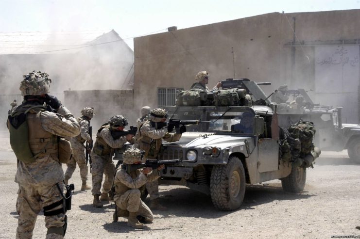 US Marines with 1st Battalion, 5th Marine Regiment firing their weapons