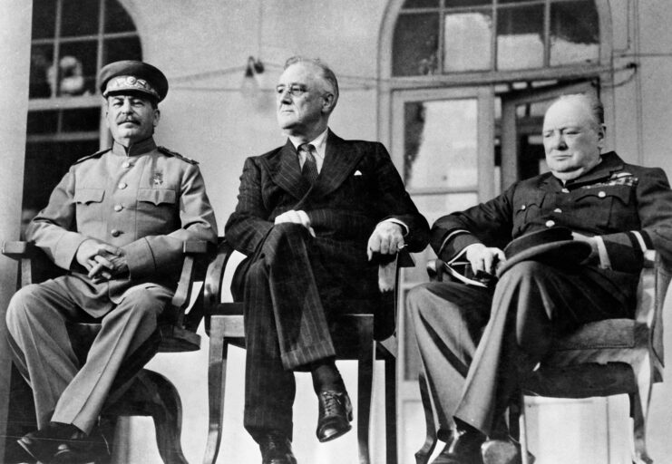 Joseph Stalin, Franklin D. Roosevelt and Winston Churchill sitting in chairs