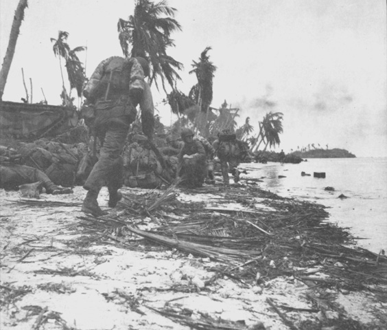 US Marines walking along a beach