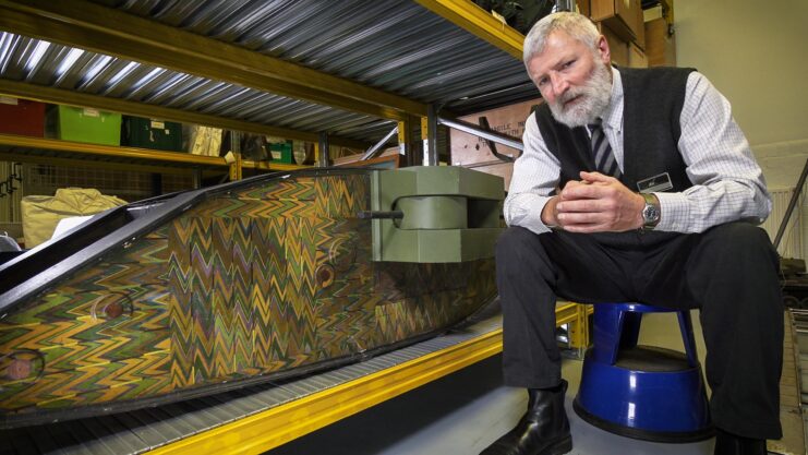 David Willey sitting beside a female Mark I tank model