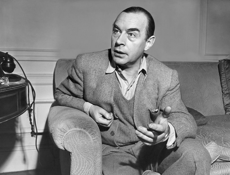 Erich Maria Remarque sitting on a couch
