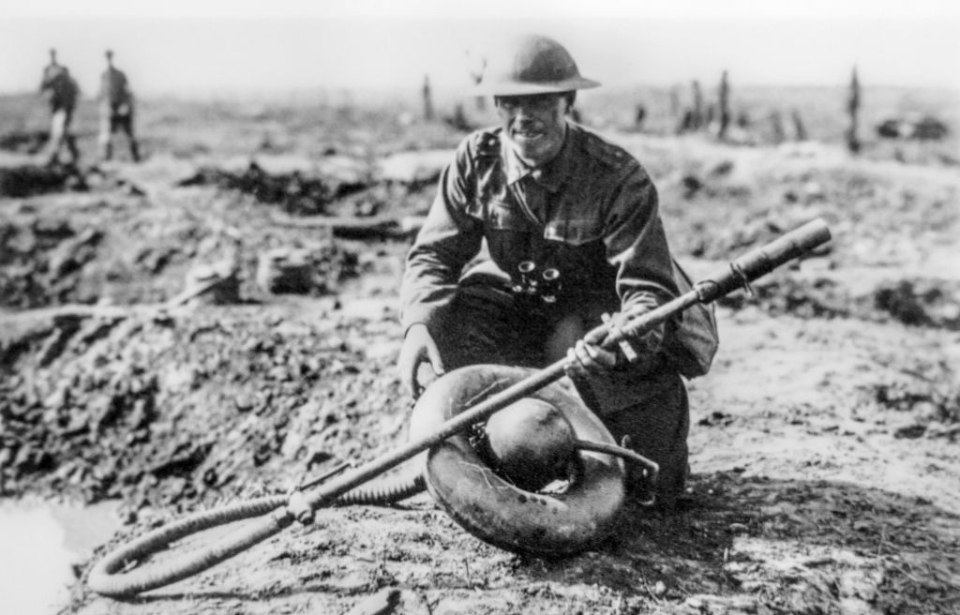 Australian soldier kneeling with a captured Wechselapparat