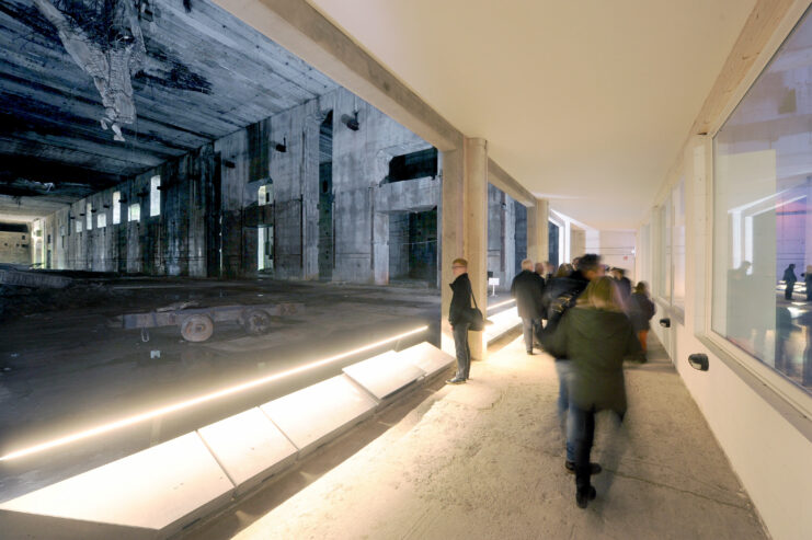 Visitors walking along a hallway at the Valentin U-boat pen