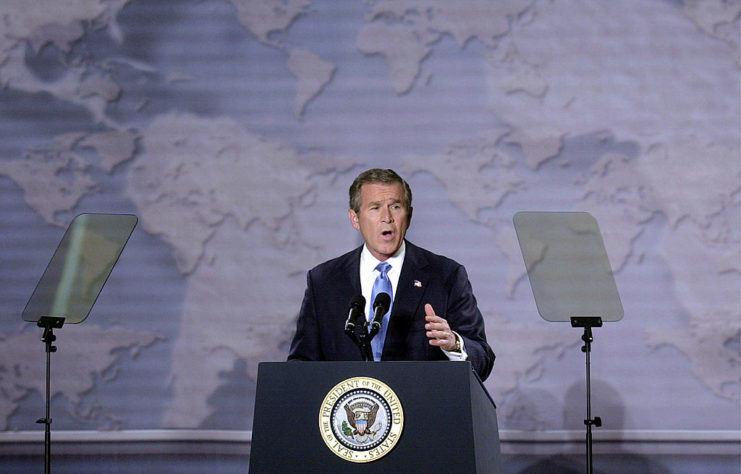 George W. Bush speaking at a podium