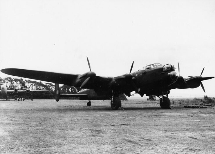 Avro Lancaster parked on dirt-packed ground