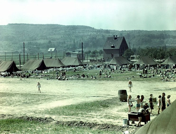 Female prisoners of war (POWs) standing together outside at a Rheinwiesenlager prison camp