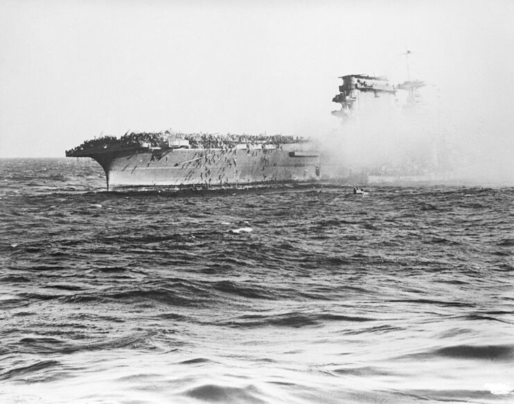 Crewmen jumping off the side of the USS Lexington (CV-2)