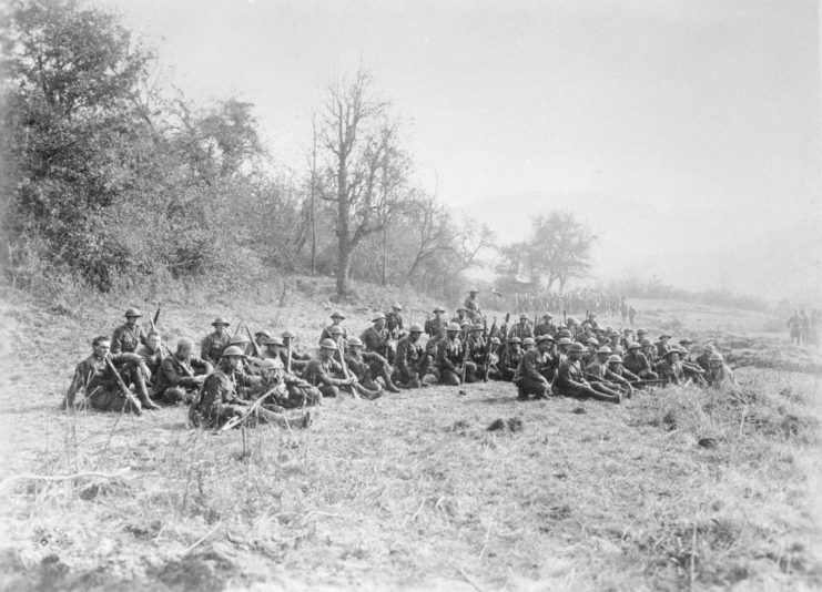 Members of the Lost Battalion sitting in a field