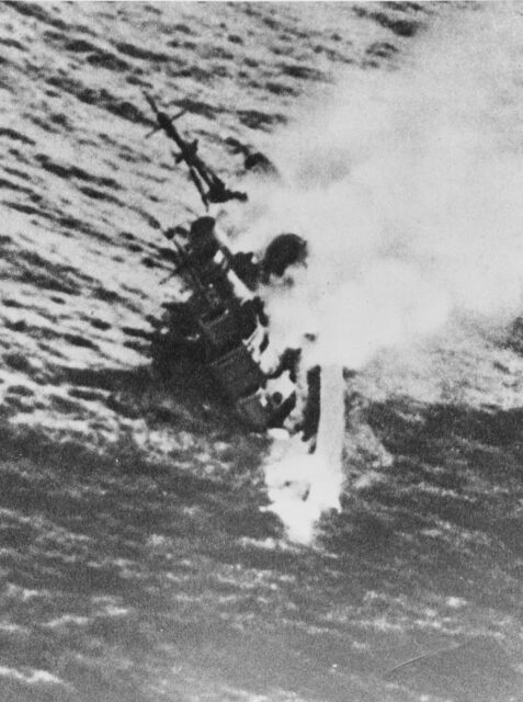 HMS Exeter (68) sinking into the water