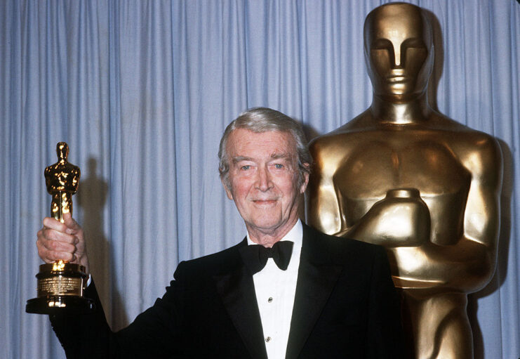 James Stewart holding up his Honorary Academy Award