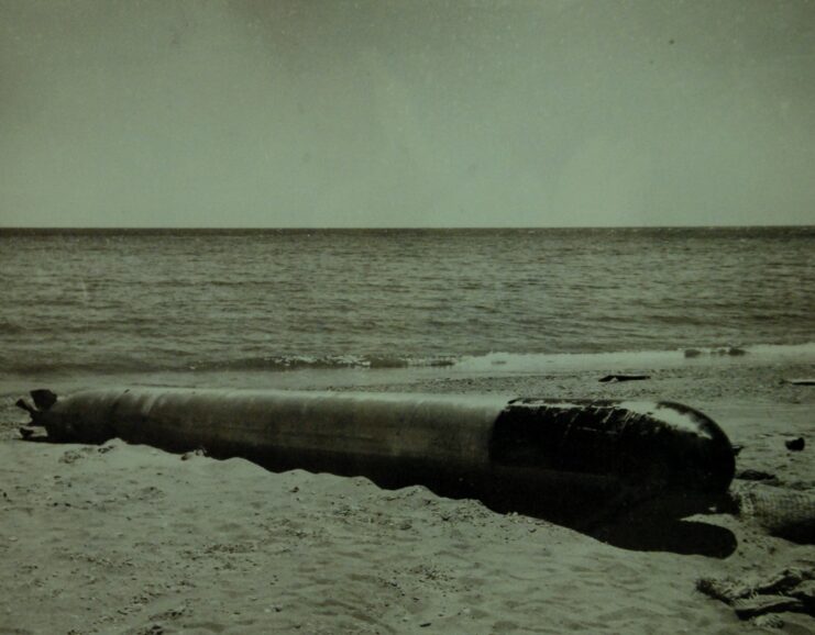 Type 93 torpedo lying on a beach