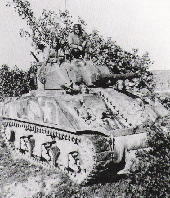 Creighton Abrams and other US Army personnel manning a tank