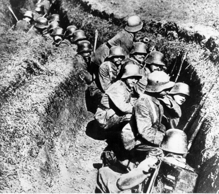 German soldiers crouching in a trench