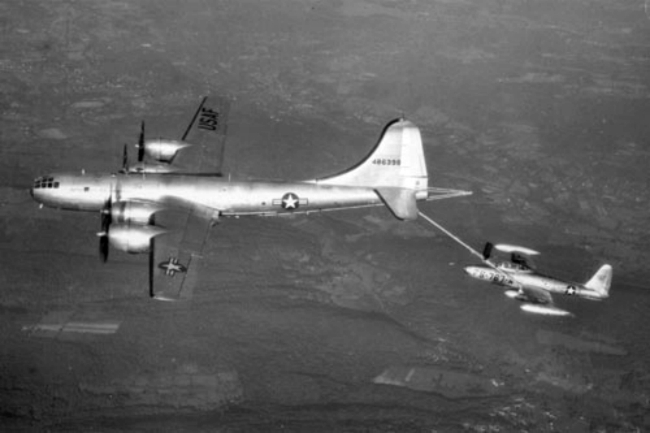 Boeing YKB-29J Superfortress linked with a Republic F-84E Thunderjet mid-flight