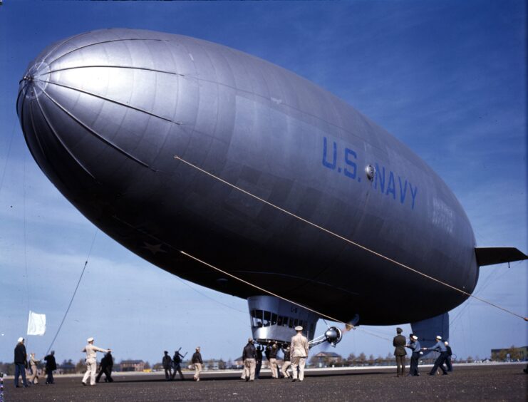 Line-handling crew standing beneath L-6 as it lands