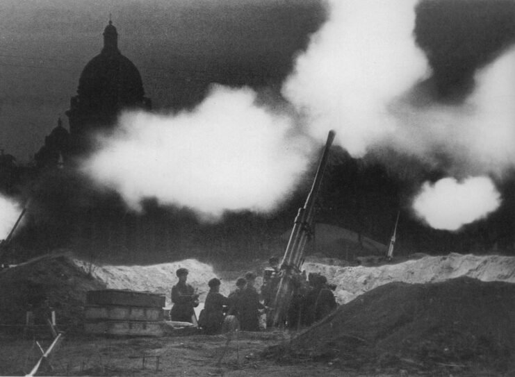 Red Army soldiers manning an anti-aircraft gun at night