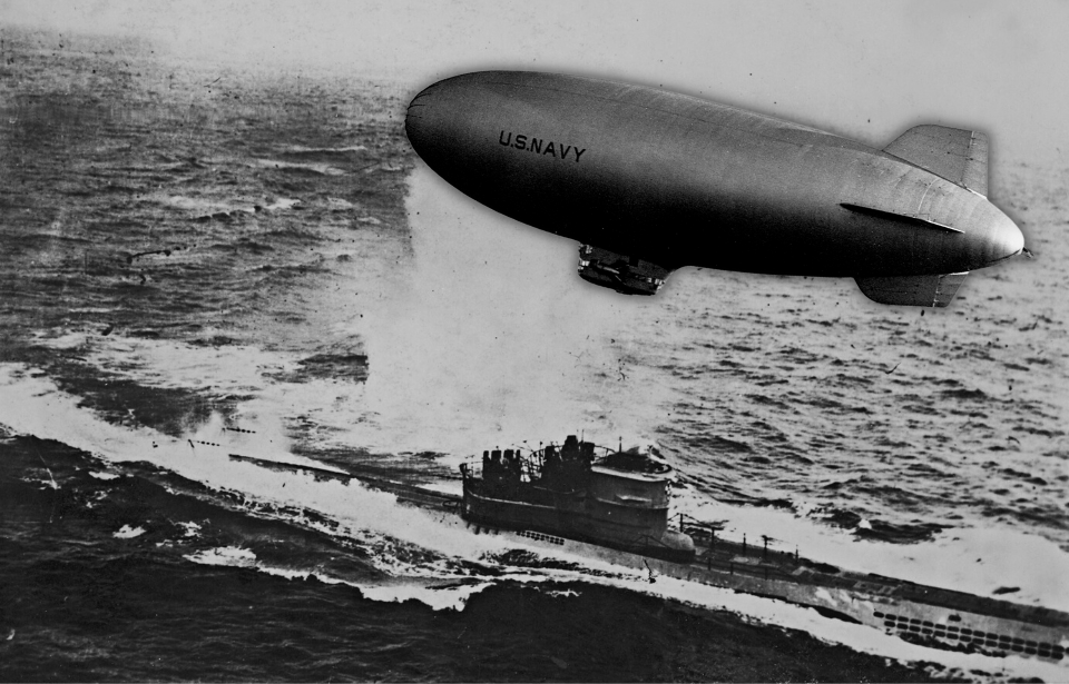 Blimp hovering over a German U-boat at sea