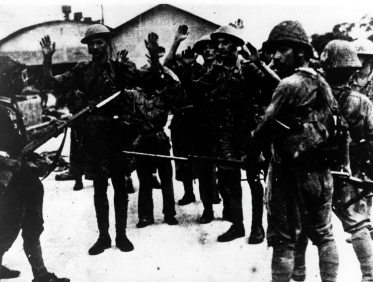 British prisoners of war (POWs) standing with their captors