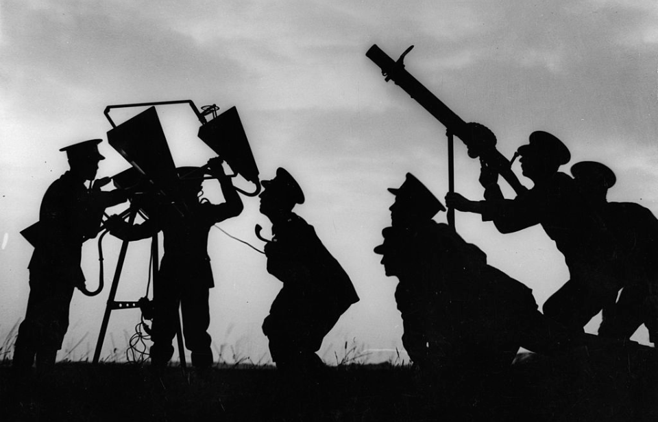 Silhouette of soldiers manning a sound detector
