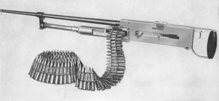 Drawing of the Darne machine gun with a belt of ammunition being fed through it