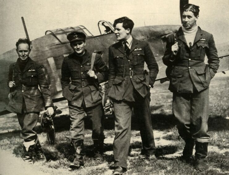 Lionel Pilkington, H.G. Paul, Newell Orton and Edgar "Cobber" Kain walking away from a Hawker Hurricane Mk I