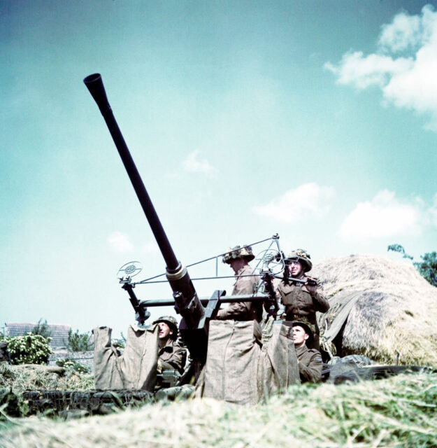 Four members of the 3rd Canadian Infantry Division manning a Bofors 40 mm anti-aircraft gun