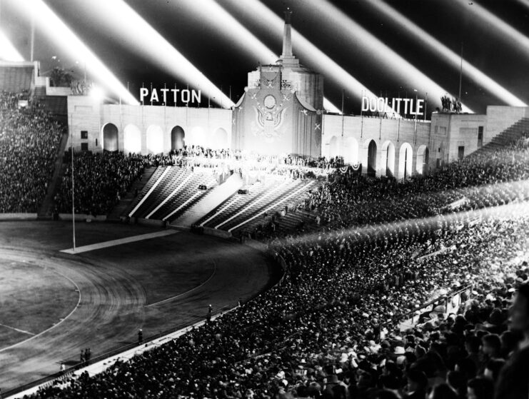 Spotlights shining over the crowd at the LA Coliseum