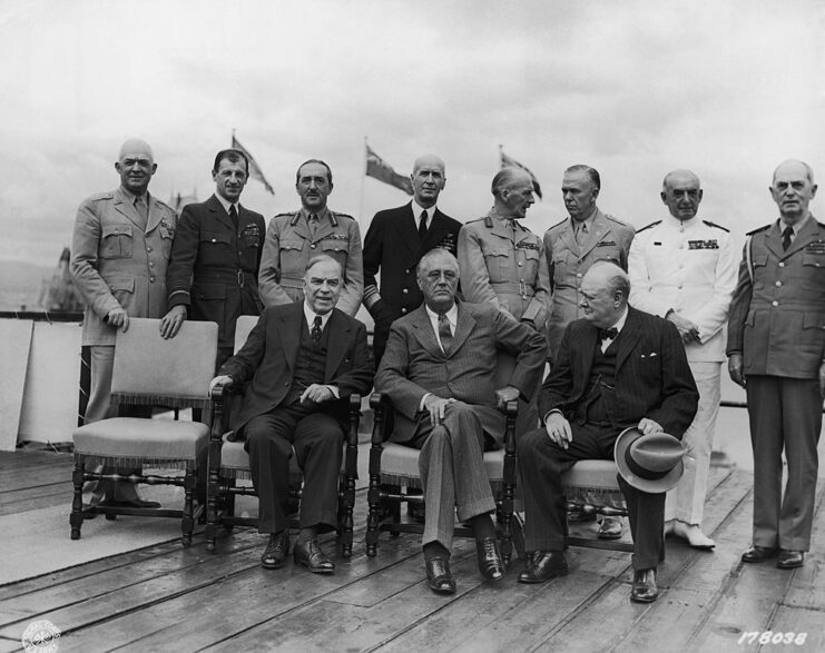 Mackenzie King, Franklin Roosevelt, Winston Churchill, Henry Arnold, Charles Portal, Sir Alan Brooke, Ernest King, Sir John Dill, George Marshall, Sir Dudley Pound and W.D. Leahy standing together