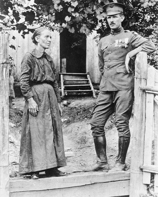 Sgt Alvin York standing outside with his mother