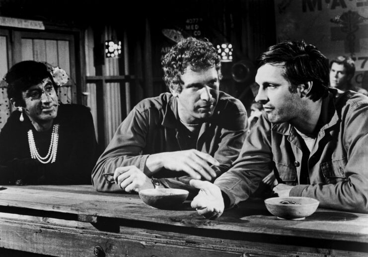 Jamie Farr, Wayne Rogers and Alan Alda as Cpl. Maxwell Q. Klinger, Capt. John "Trapper" McIntyre and Capt. Benjamin Franklin "Hawkeye" Pierce in 'M*A*S*H'